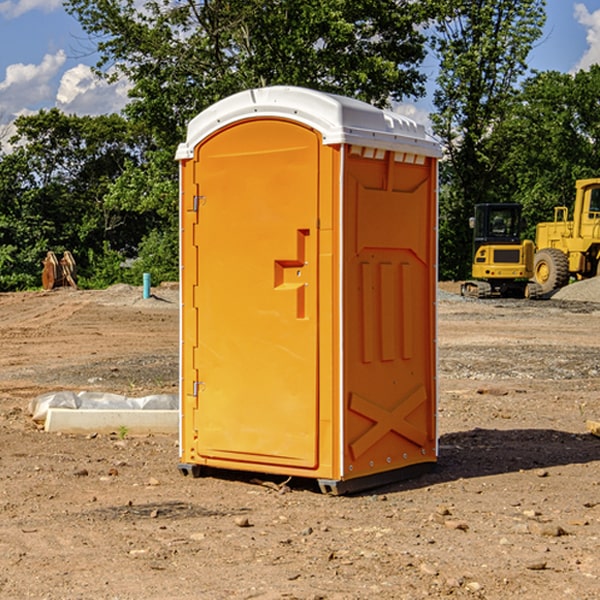 what is the cost difference between standard and deluxe portable toilet rentals in Jackson County Iowa